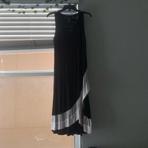 A black dress with a white stripe at the bottom. It’s a small.